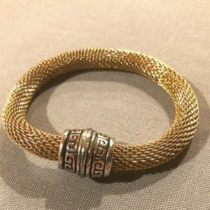 Beautiful goldtone metal mesh bracelet with silver greek key design closure